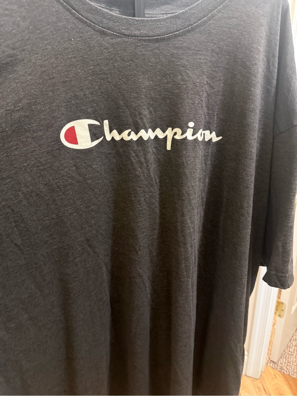 Champion Black Short-Sleeve Tee with White Script and Red Emblem
